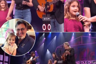 The Grand Ole Opry has seen countless emotional moments, but nothing in the last five years—and maybe nothing in the next five—can compare to this one. The crowd went silent as Vince Gill walked out holding the hand of his granddaughter, Everly, ready for her very first Opry performance.  With her mom standing proudly beside her and her grandpa guiding her every step, Everly stepped up to the mic and began a song that held deep meaning for their family. Her tiny voice, full of heart and honesty, filled the room and made even the toughest country fans tear up.  It wasn’t just a debut—it was three generations sharing one unforgettable moment, the kind that stays with you long after the lights fade… WATCH BELOW 👇👇👇