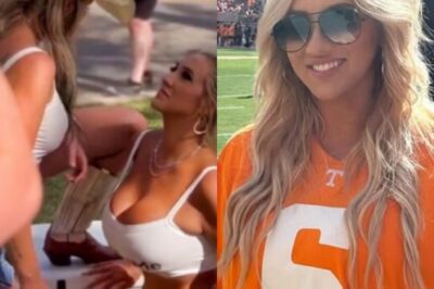 PHOTOS: Tennessee Vols Fan Who Broke the Internet with R𝙖unchy Tailgate Video Goes Viral Again – Blasts American Airlines for Forcing Her to Button Up Her Low-Cut Top. The Tennessee Vols fan who once broke the internet with her wild tailgate video is suddenly back in the spotlight again. She’s now blasting American Airlines after claiming staff forced her to button up her revealing top before boarding a flight. The new photo and her fiery complaint are spreading everywhere, instantly sparking a huge online argument. Fans across social media are already choosing sides in the latest viral drama.
